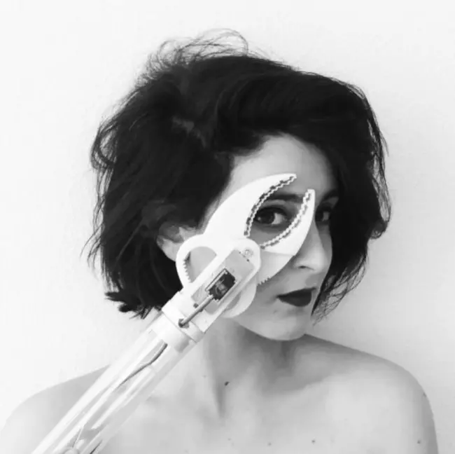 Clémence Martel with tool framing her eye
